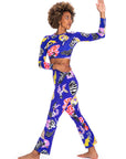Woman wearing a colorful athletic outfit on a white background