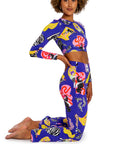 Woman wearing a colorful athletic outfit with a white background