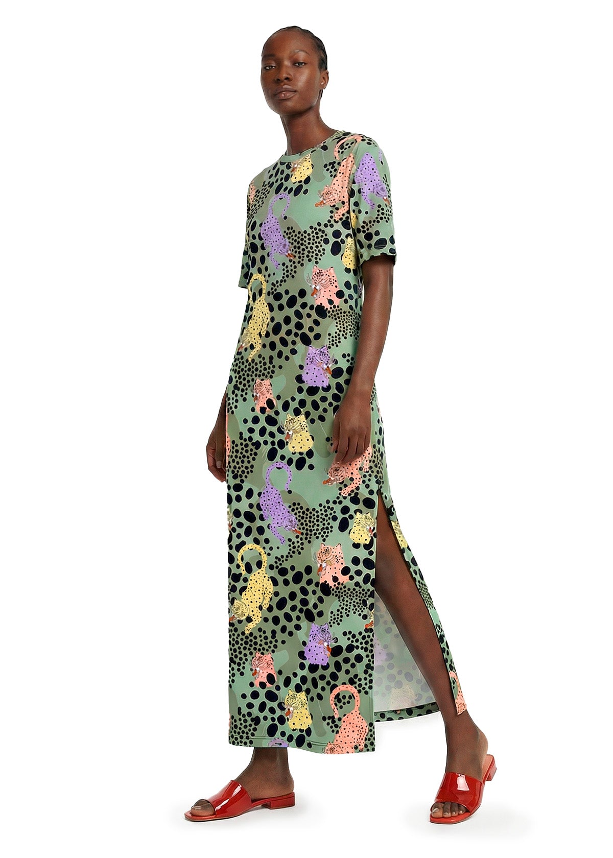 Woman wearing a patterned dress on a white background