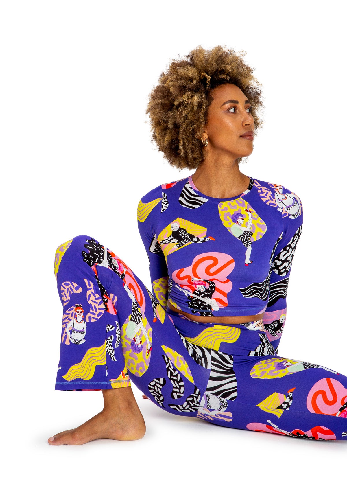 Woman wearing a colorful patterned outfit on a white background