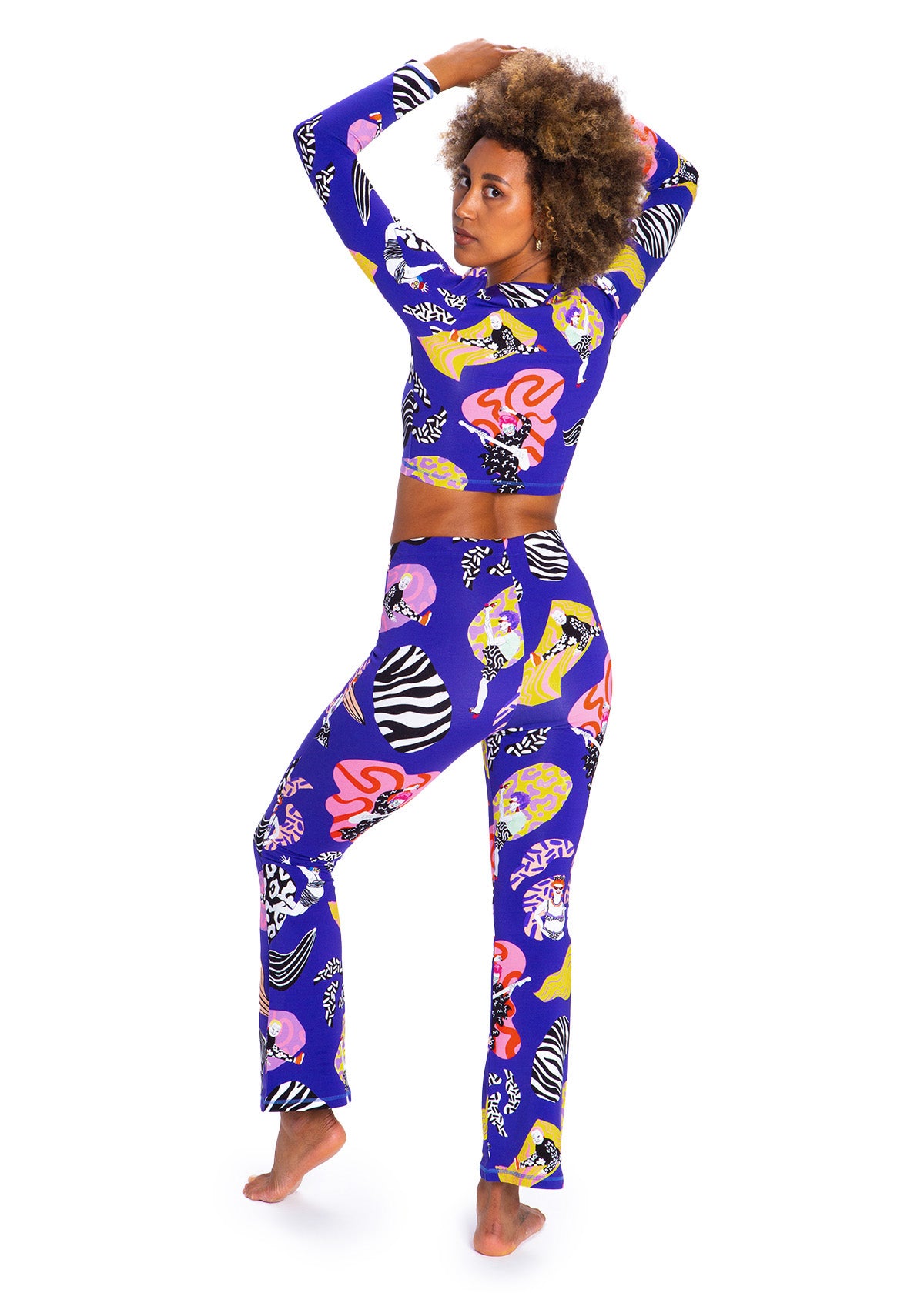 Person wearing a colorful outfit with a blue base featuring animal prints on a white background