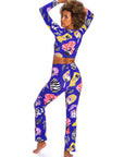 Person wearing a colorful outfit with a blue base featuring animal prints on a white background