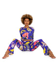 Woman wearing a colorful patterned outfit on a white background