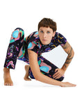 Person wearing a colorful, patterned outfit on a white background