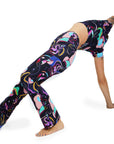 Person wearing colorful patterned leggings on a white background