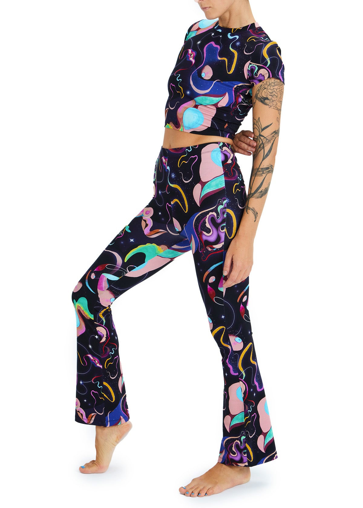 Person wearing a colorful patterned outfit on a white background