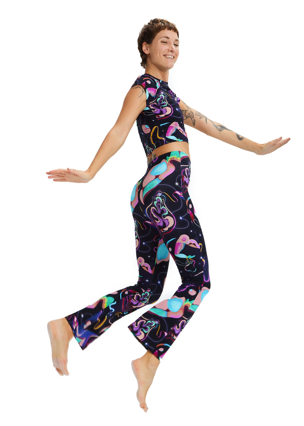 Person wearing a colorful patterned outfit on a white background